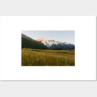 Mount Cook National Park at daybreak as rising sun strikes peaks of surrounding mountains Posters and Art